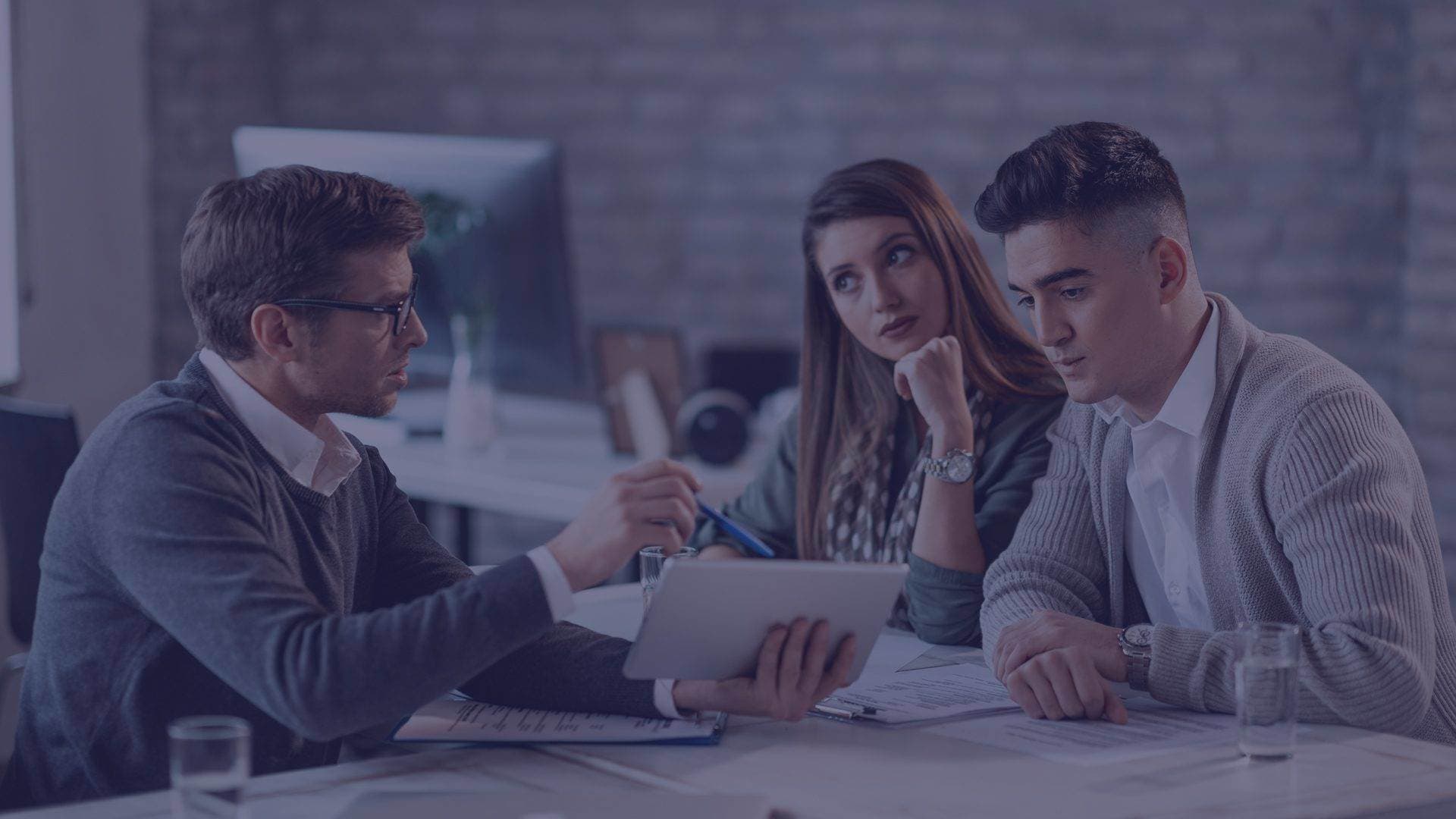 Business team reviewing documents in an office setting